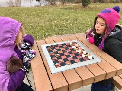 Outdoor checkers with rocks and shells